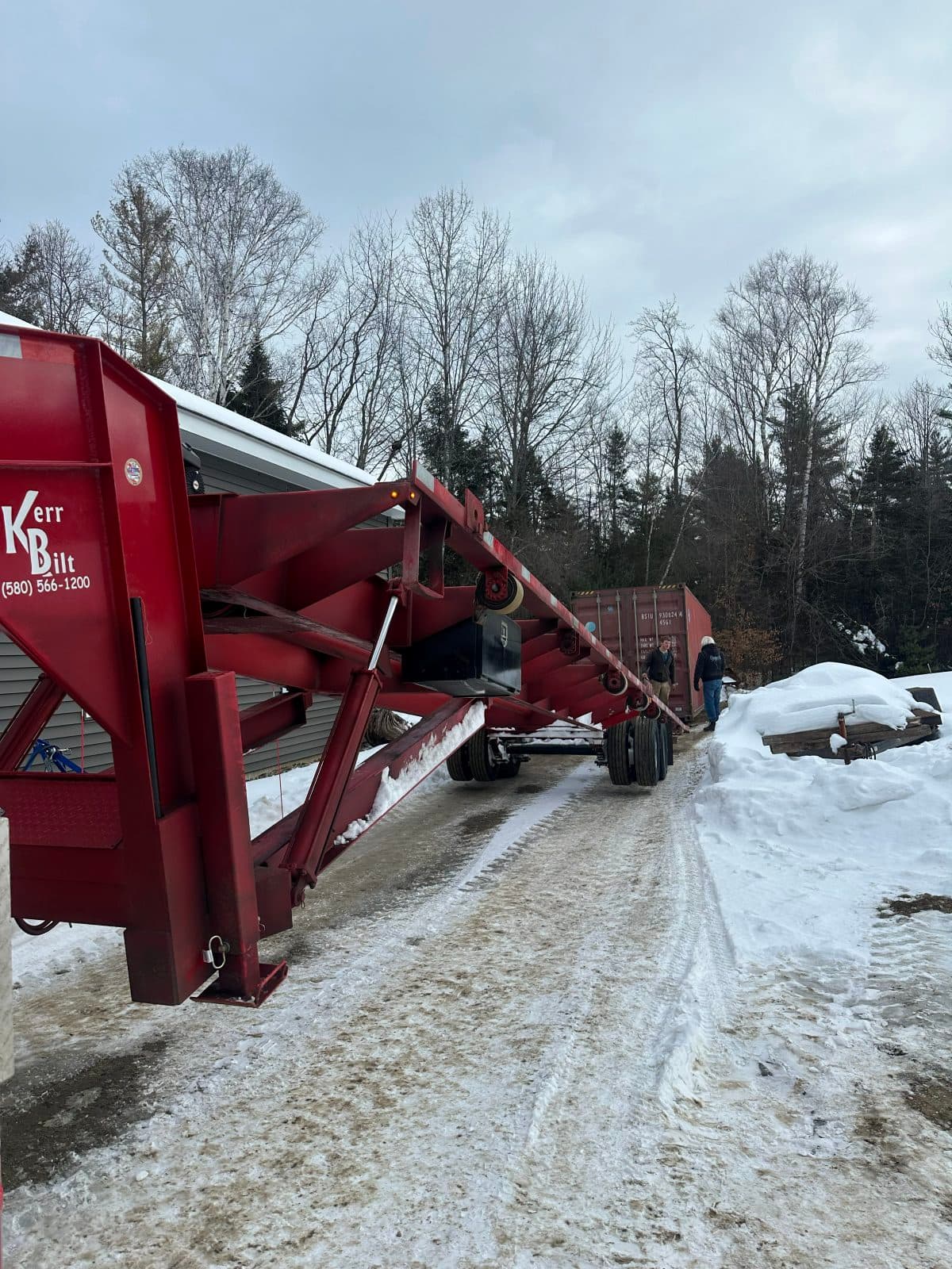 Container delivery in snow with plowed snowbanks on either side